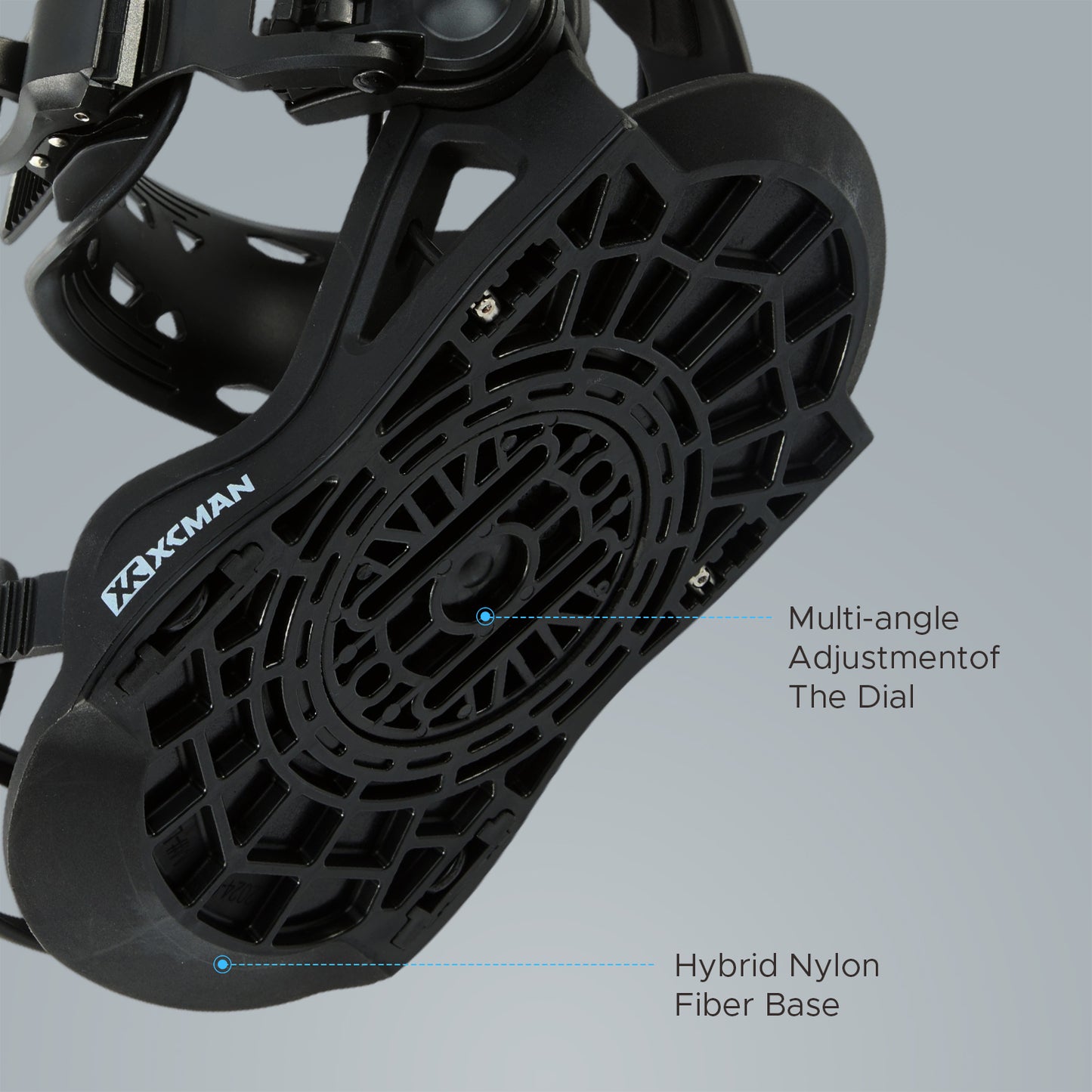 Bottom baseplate view of XCMAN 360 Seco Pro black snowboard bindings showing the hybrid nylon fiber base and multi-angle adjustment dial