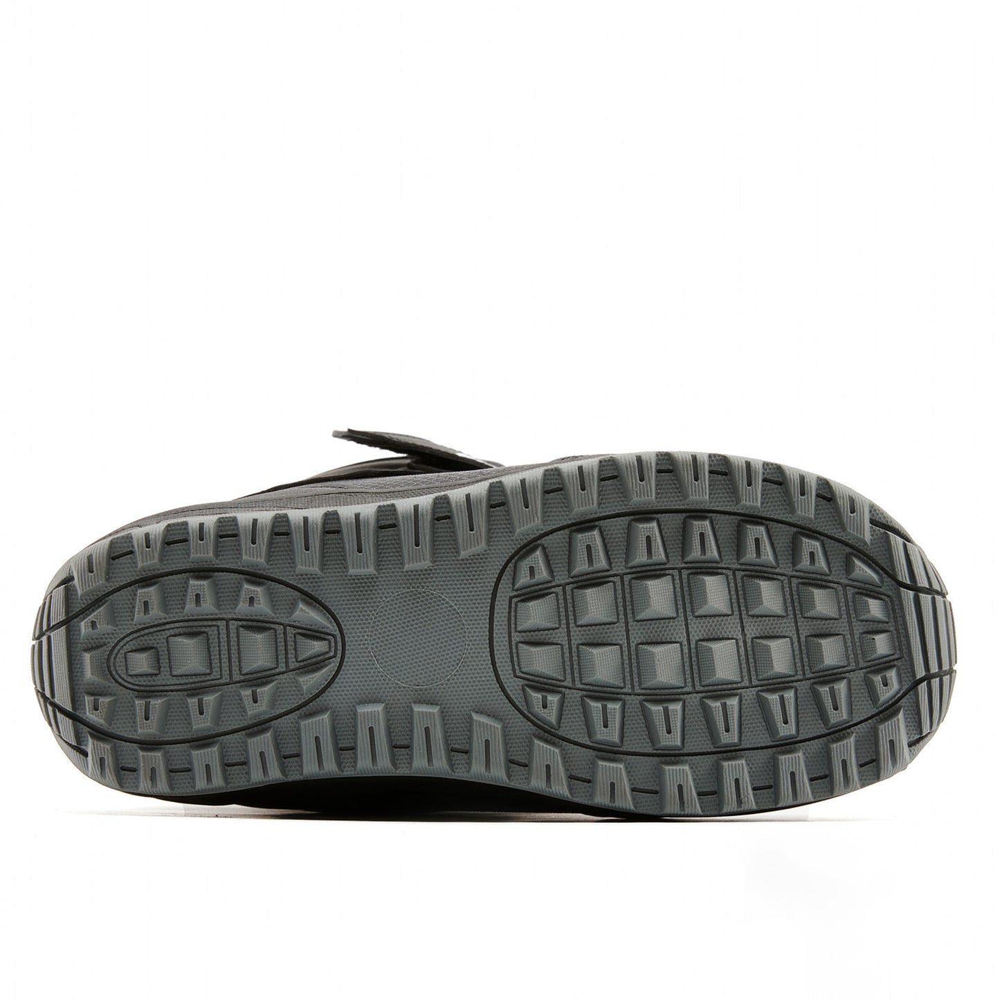 Bottom sole view of XCMAN NOX-II snowboard boots showing the anti-slip rubber traction tread pattern