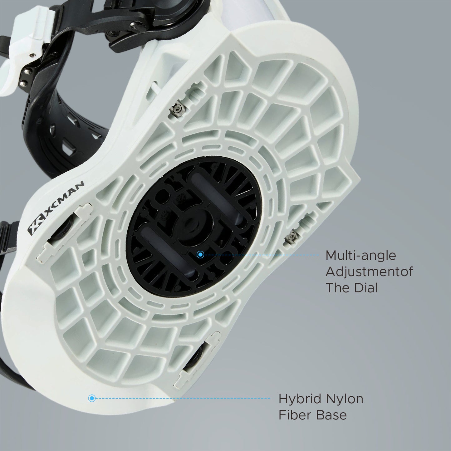 Bottom baseplate view of XCMAN 360 Seco Pro black and white snowboard bindings showing the hybrid nylon fiber base and multi-angle adjustment dial