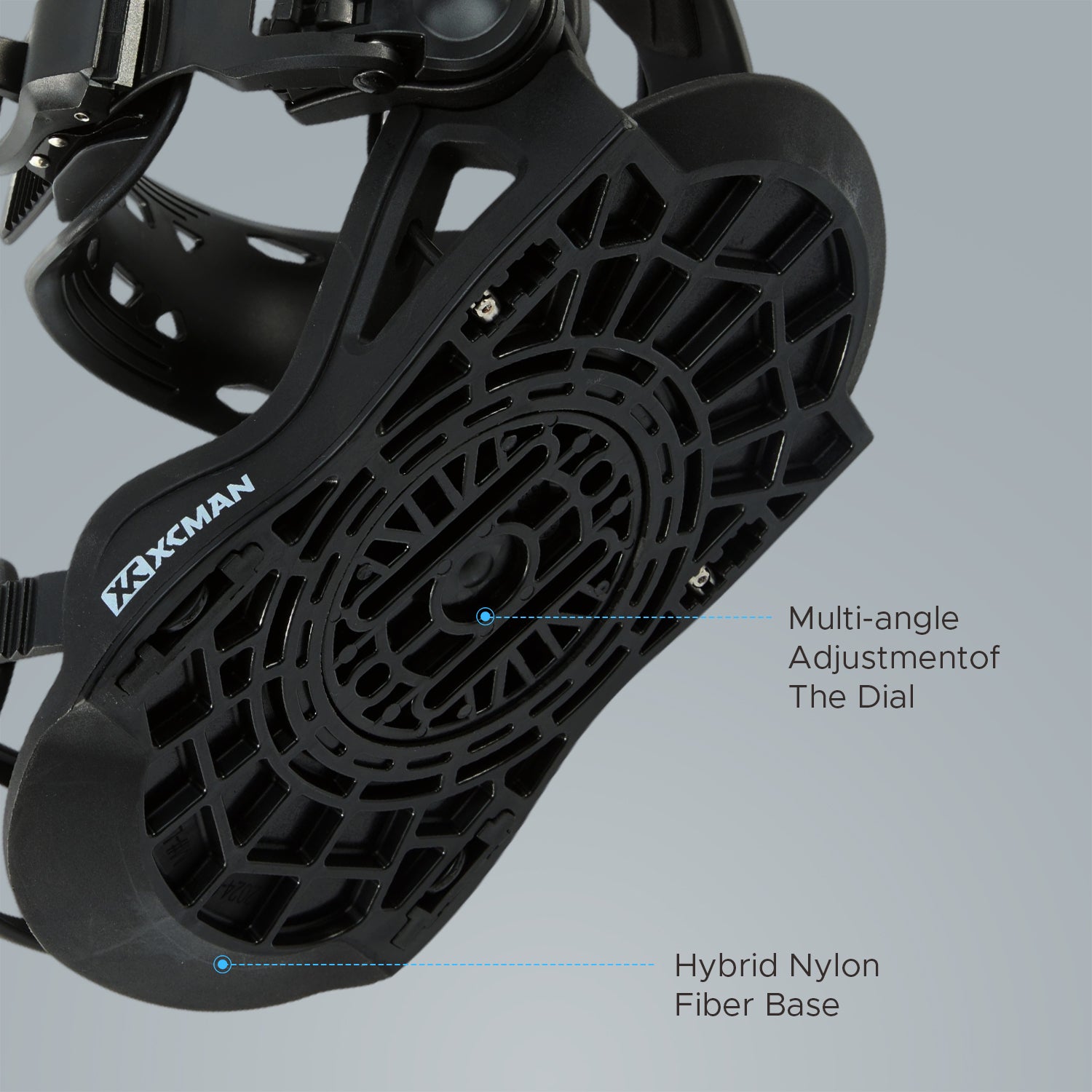 Bottom baseplate view of XCMAN 360 Seco Pro black snowboard bindings showing the hybrid nylon fiber base and multi-angle adjustment dial