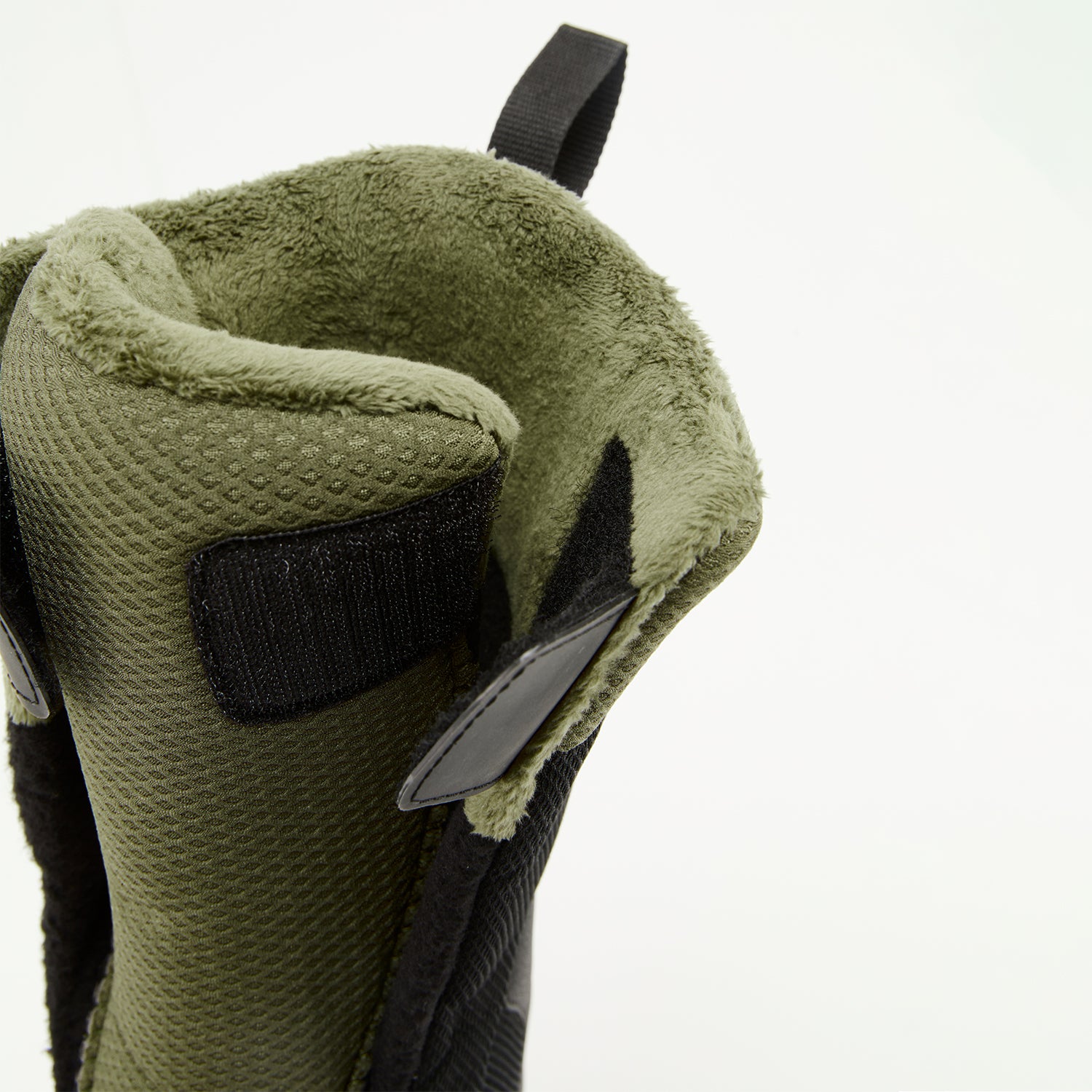 Detailed view of the internal harness, tongue, and secure strap system inside XCMAN NOX-I boots