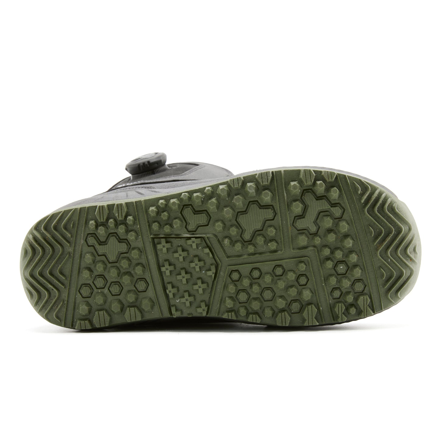 Bottom sole view of XCMAN NOX-I snowboard boots showing the anti-slip rubber traction tread pattern