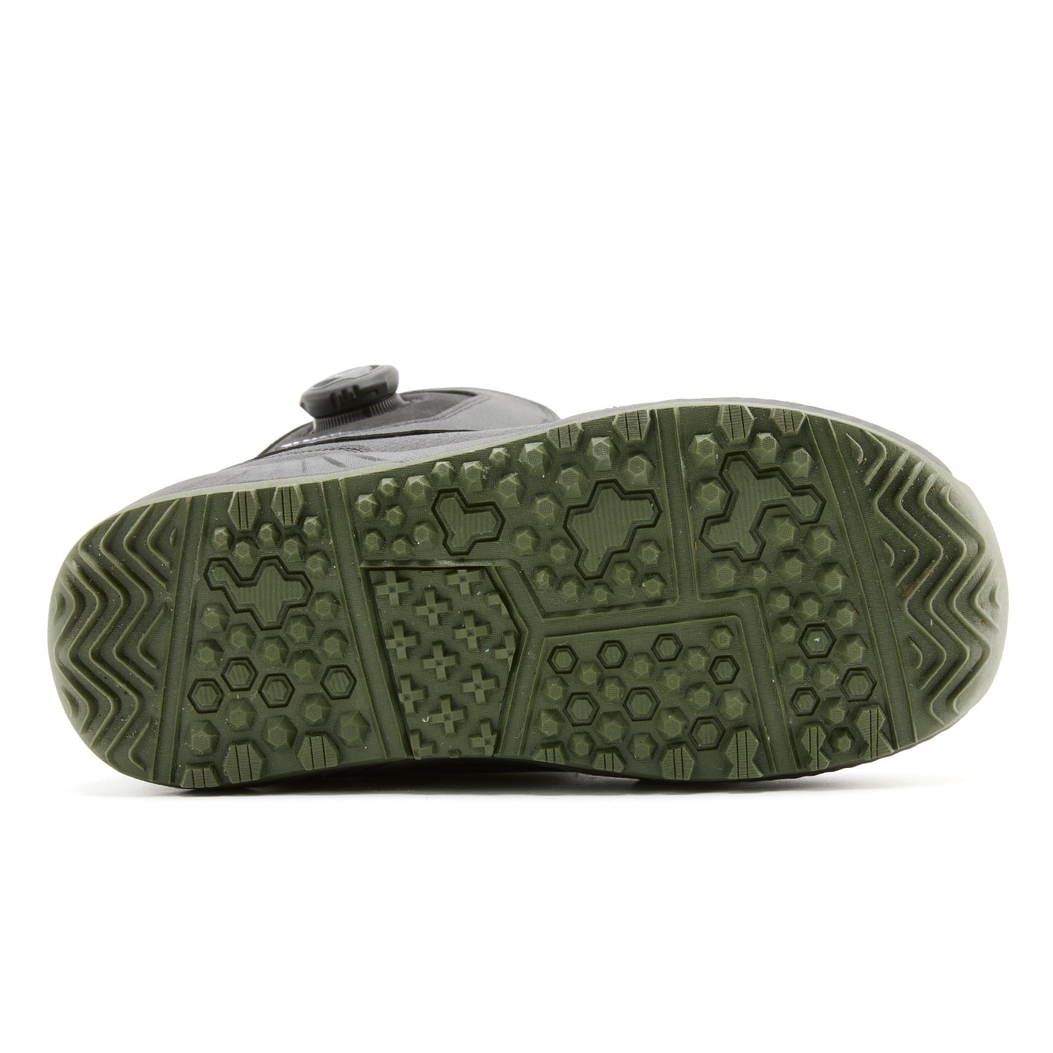 Bottom sole view of XCMAN NOX-I snowboard boots showing the anti-slip rubber traction tread pattern